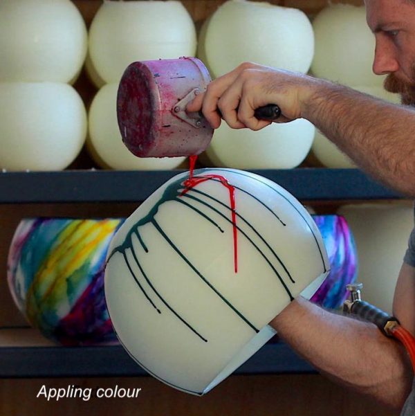 Applying pigments to the lantern prior to blending the colours by torch. Photo: Integrity Candles