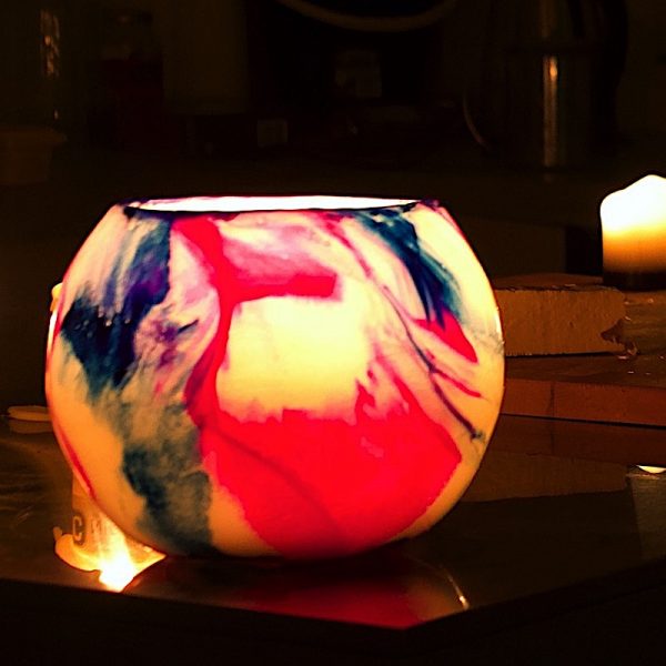 Pink and blue swirl organically. Photo by Integrity Candles.
