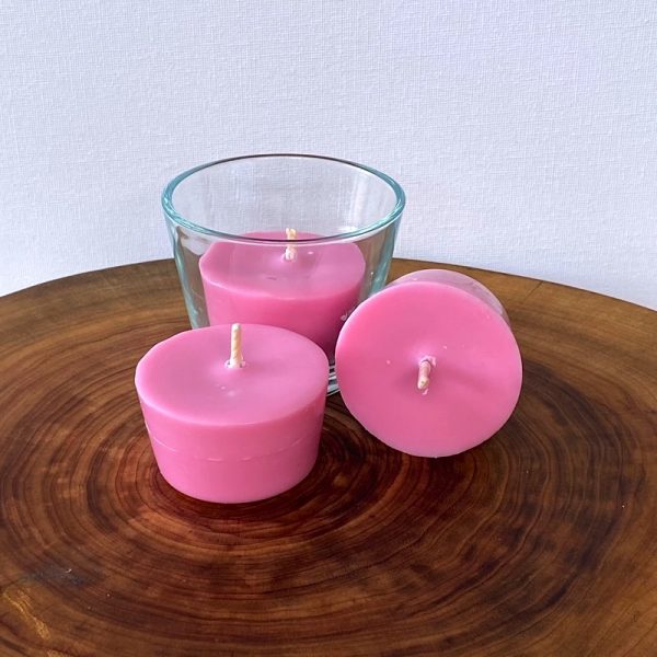 Three Rose & Geranium pure soy Votive candles, with one glass, burn brightly for a total of 36 hours with an exquisitely divine perfume.