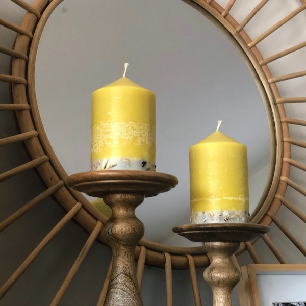 A Revitalising range is infused with essential oils of Lime, Lemongrass and Cedarwood. Fresh green in colour, these candles feature a white base embedded with river pebbles.